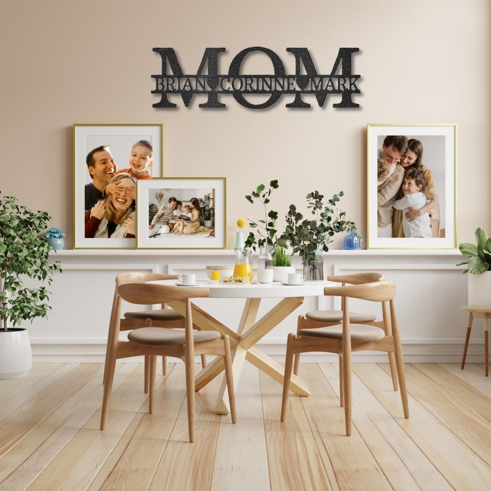 Dining room with a 'MOM' wall decoration and family photos on the wall.