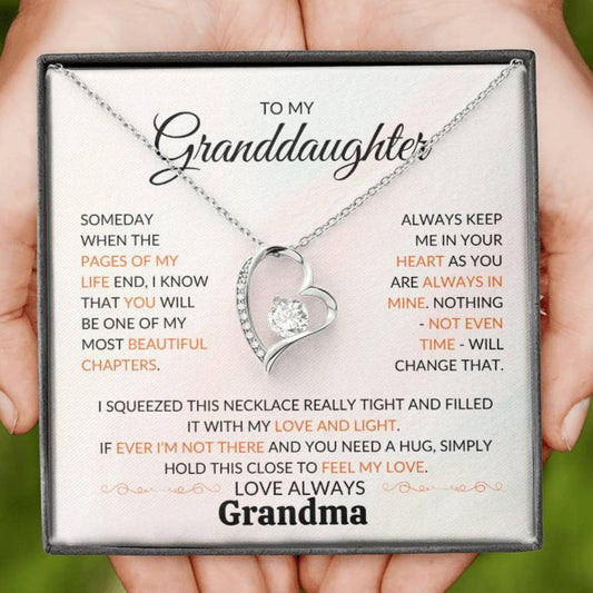 A beautiful message from Grandma to Granddaughter behind a white gold chain with a heart pendent. 