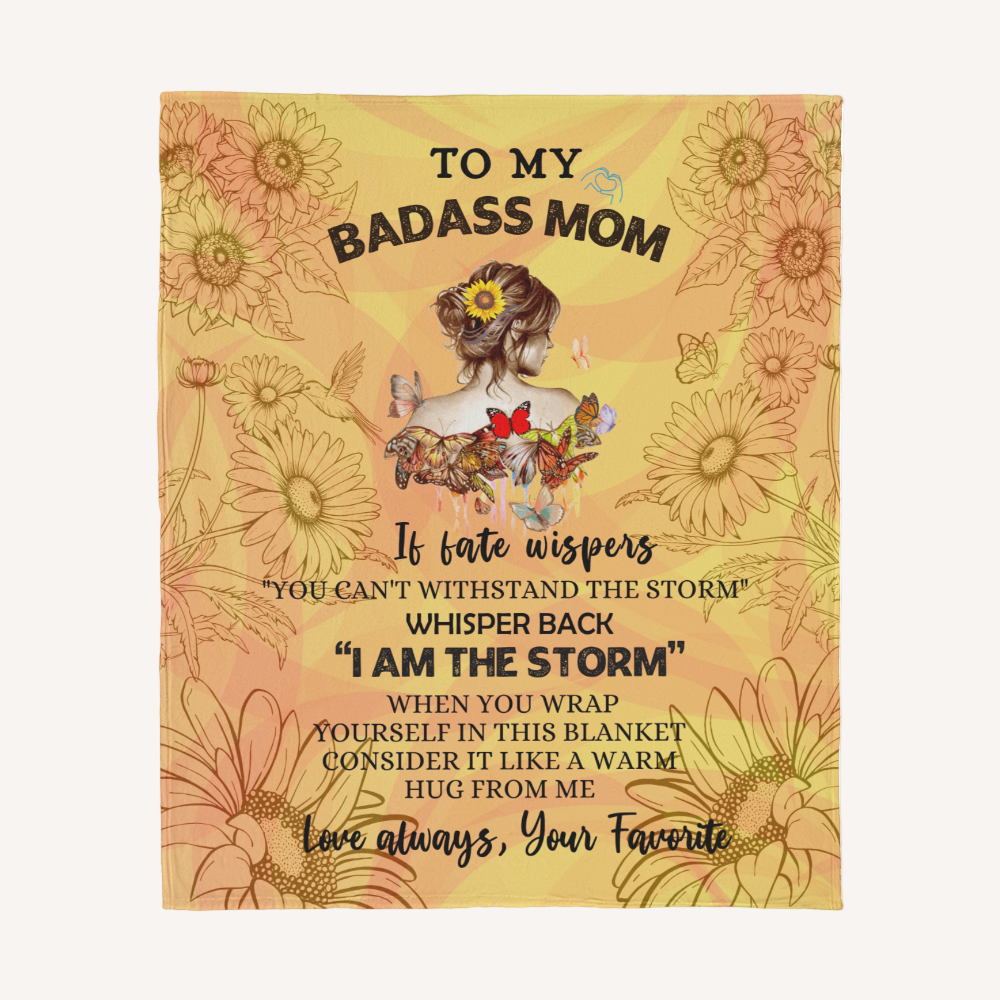 Blanket with floral design and text for a badass mom on a white background