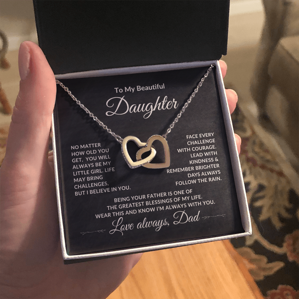 Sentimental jewelry gift from Dad to Daughter with elegant necklace and message being held.