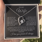 Heart-shaped necklace in a gift box with a sentimental message for a wife.