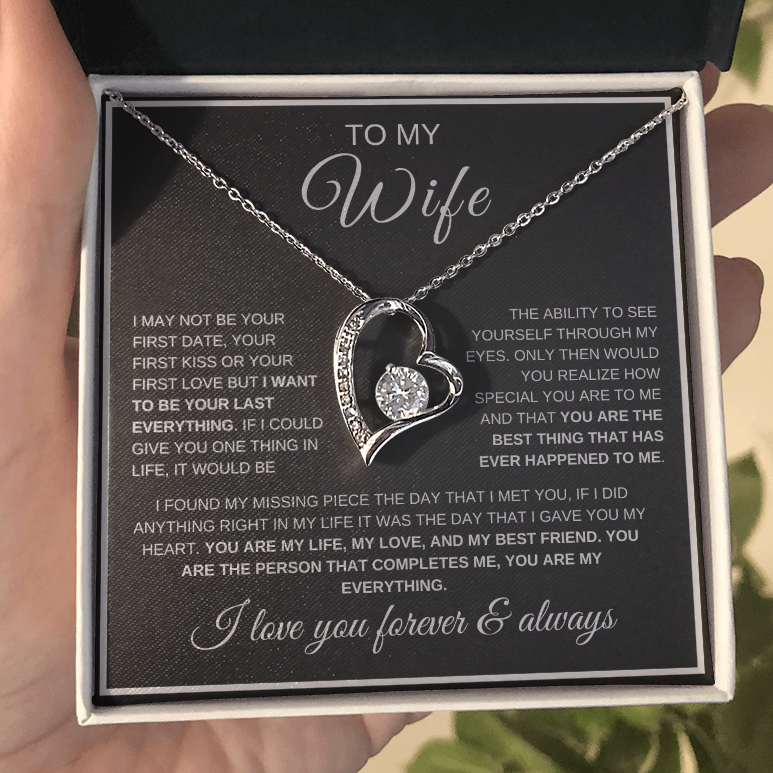Heart-shaped necklace in a gift box with a sentimental message for a wife.
