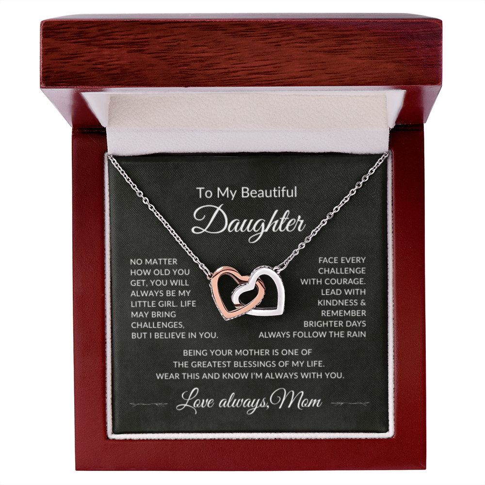 Interlocking hearts necklace displayed in luxury gift box for daughter from mom