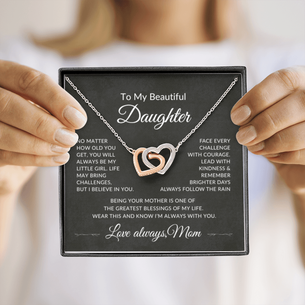 Meaningful daughter necklace gift from mom shown during unboxing