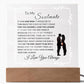 An LED acrylic lamp with a wooden base, featuring a quote about love and commitment to a soulmate. Corded